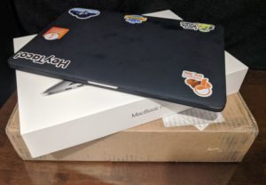 Apple Laptop with Cover and Stickers